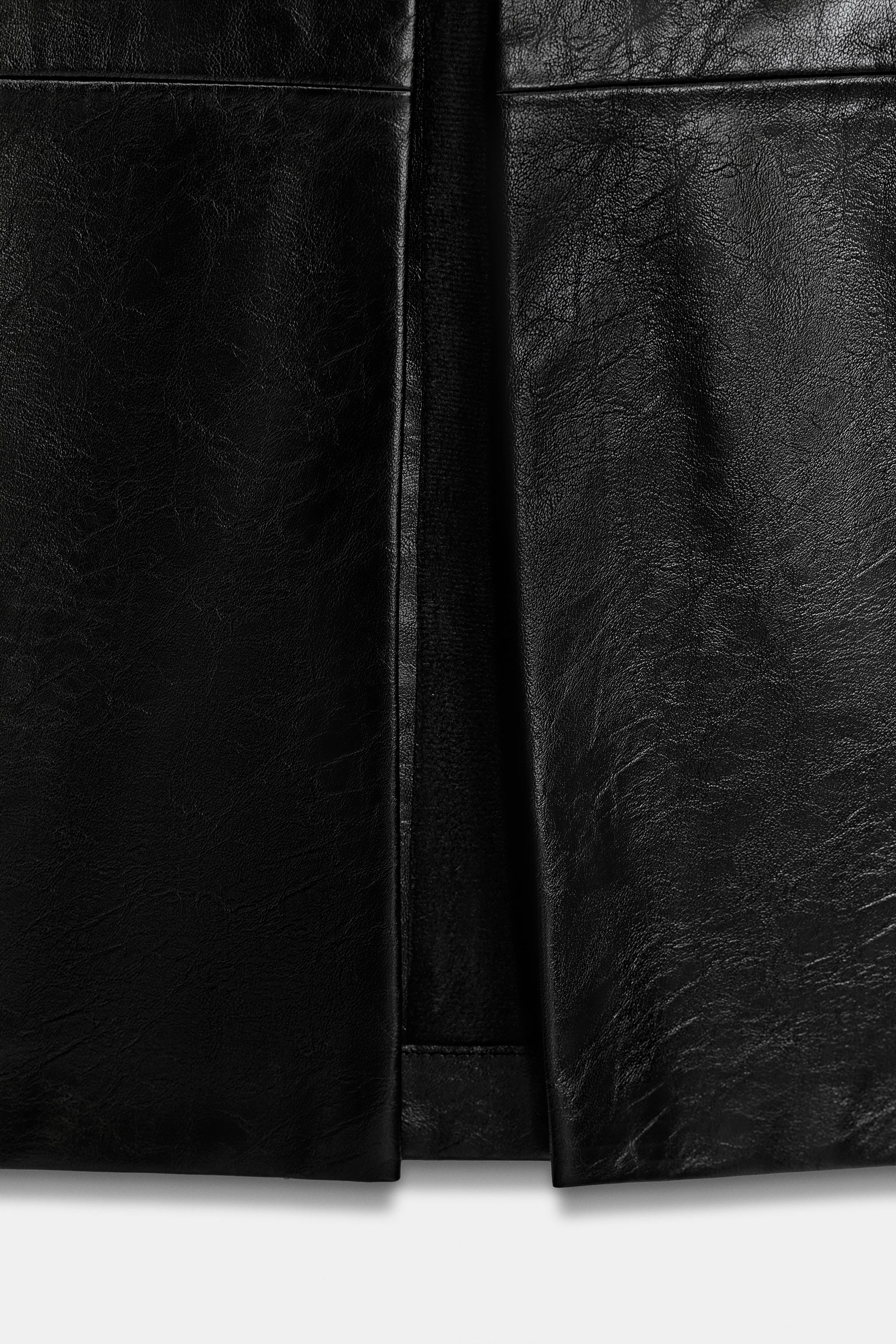 JUPE MI-LONGUE MATIÈRE SYNTHÉTIQUE